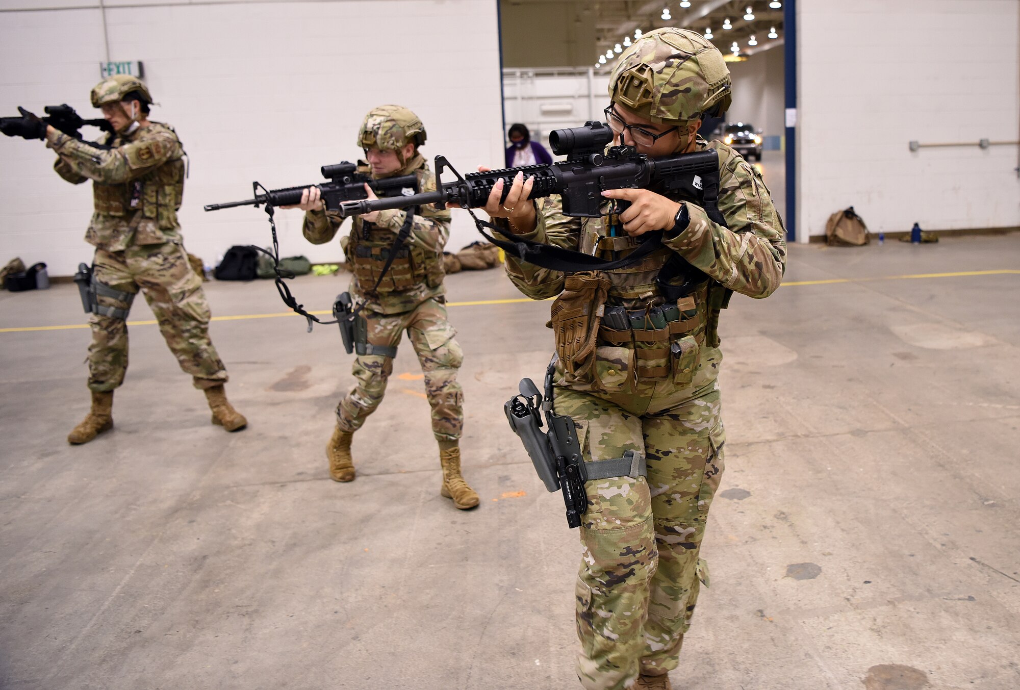 Photo of Airmen with weapons