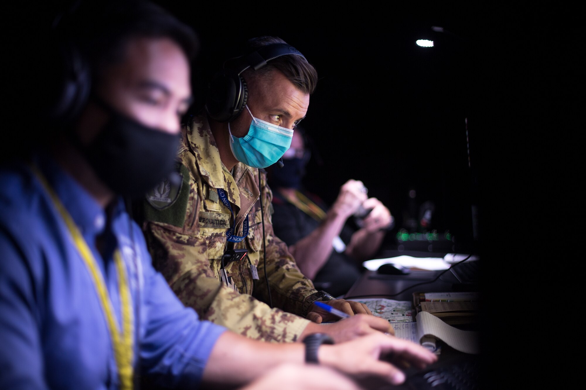 Photo of Airmen managing a flying simulator