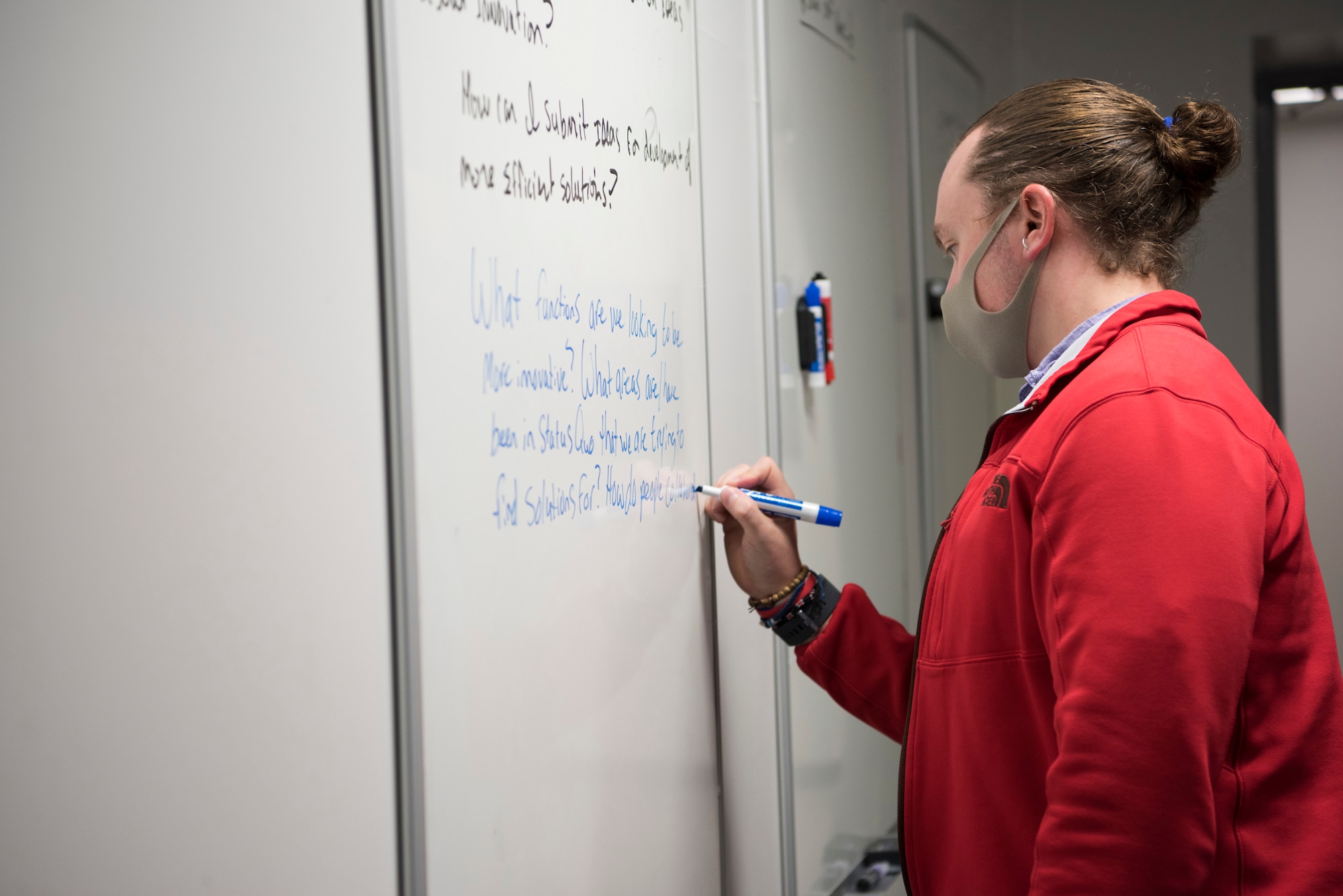 Joshua Grubb, 374th Contracting Squadron director of specialized contracting, uses the dedicated brainstorming space of the newly-opened innovation lab at Yokota Air Base, Japan, Sept. 25, 2020. The lab is presented by YokoWERX, the first AFWERX spark cell in mainland Japan. (U.S. Air Force photo by Staff Sgt. Taylor A. Workman)