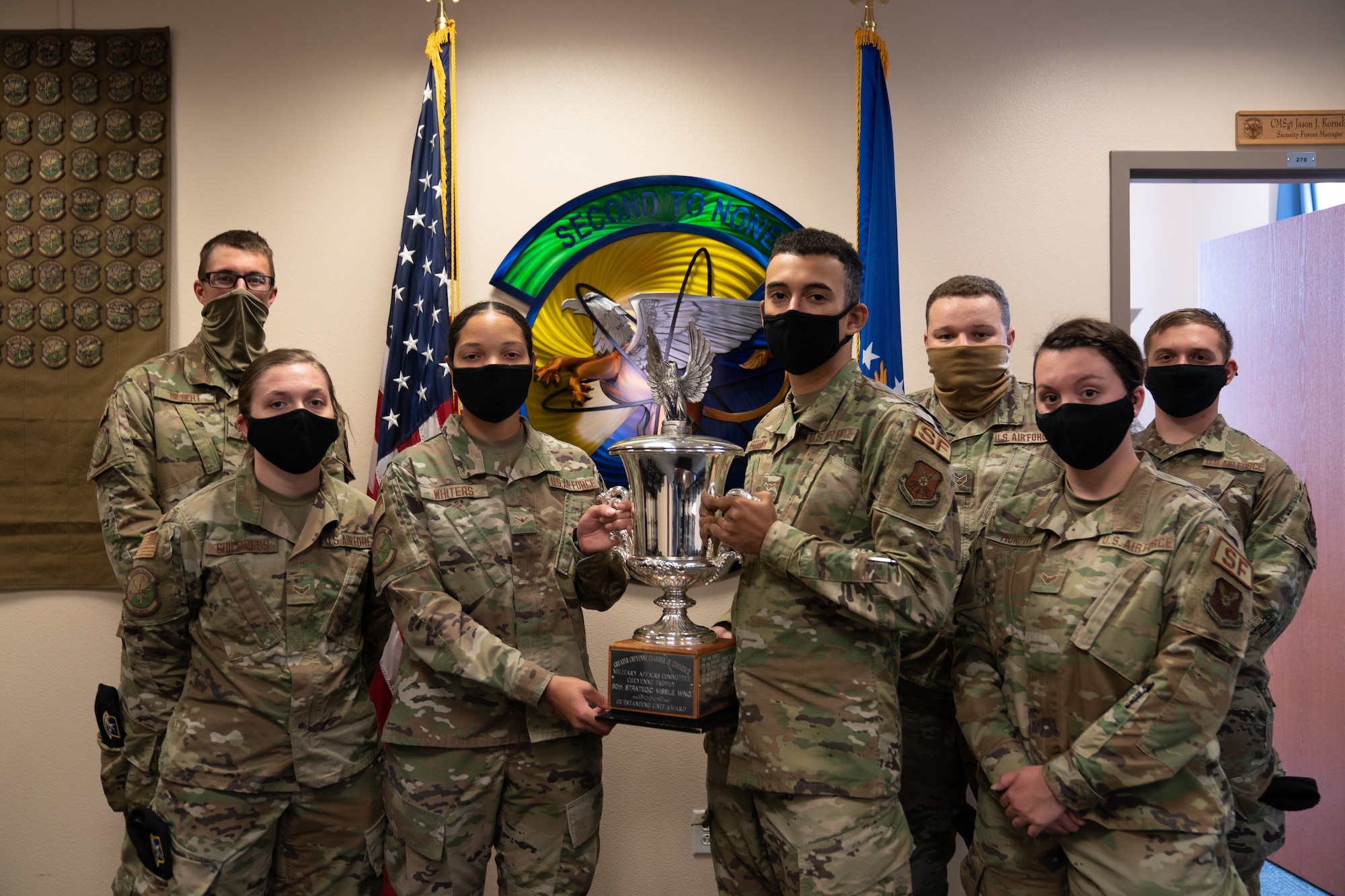 The 790th Missile Security Forces Squadron Airmen pose for photos with the Cheyenne Trophy on F.E. Warren Air Force Base, Wyoming, Sept. 10, 2020. The Greater Cheyenne Chamber of Commerce recently presented the Military Affairs Committee’s Cheyenne Trophy to the 790th Missile Security Force Squadron for mission accomplishments, patriotism, off-duty volunteerism and community involvement resulting in a positive impact on the city of Cheyenne and its residents. (U.S. Air Force photos by Joseph Coslett)