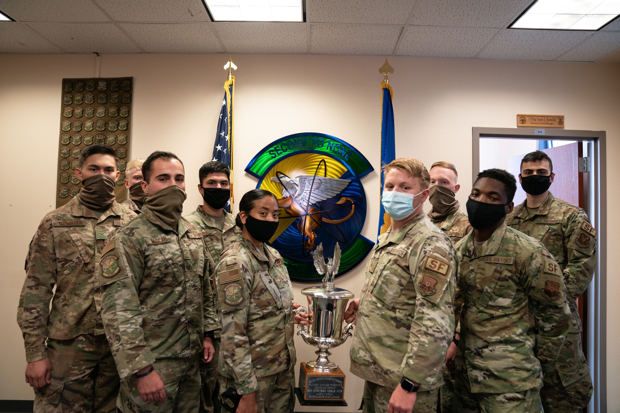 The 790th Missile Security Forces Squadron Airmen pose for photos with the Cheyenne Trophy on F.E. Warren Air Force Base, Wyoming, Sept. 10, 2020. The Greater Cheyenne Chamber of Commerce recently presented the Military Affairs Committee’s Cheyenne Trophy to the 790th Missile Security Force Squadron for mission accomplishments, patriotism, off-duty volunteerism and community involvement resulting in a positive impact on the city of Cheyenne and its residents. (U.S. Air Force photos by Joseph Coslett)