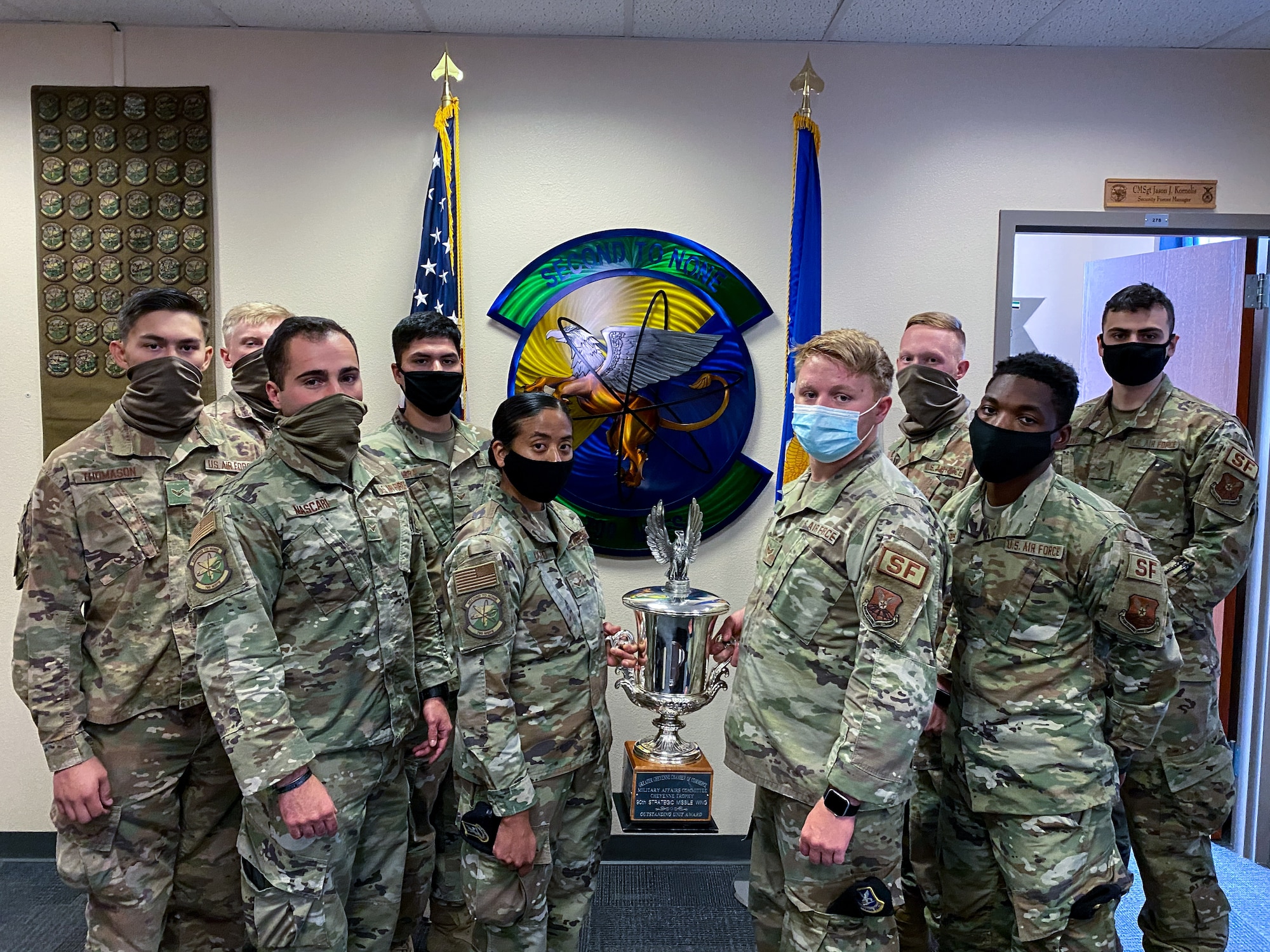 The 790th Missile Security Forces Squadron Airmen pose for photos with the Cheyenne Trophy on F.E. Warren Air Force Base, Wyoming, Sept. 10, 2020. The Greater Cheyenne Chamber of Commerce recently presented the Military Affairs Committee’s Cheyenne Trophy to the 790th Missile Security Force Squadron for mission accomplishments, patriotism, off-duty volunteerism and community involvement resulting in a positive impact on the city of Cheyenne and its residents. (U.S. Air Force photos by Joseph Coslett)