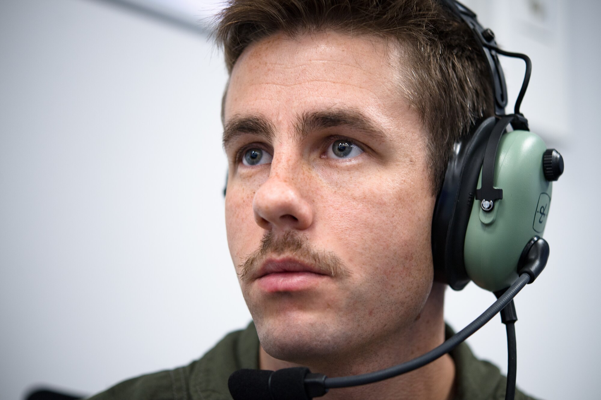 Photo of Airman wearing headset