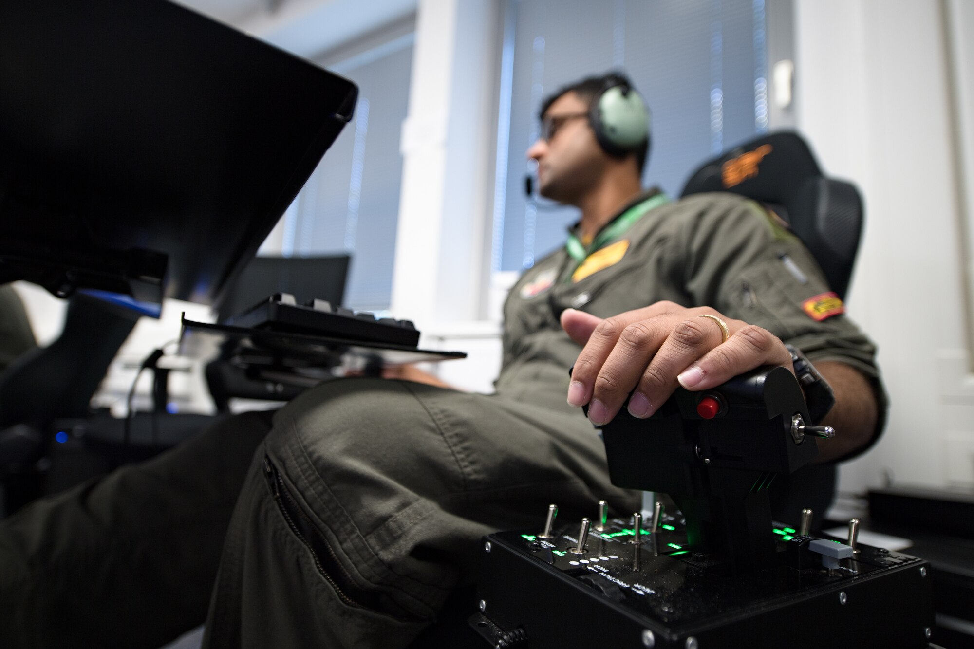 Photo of Airmen using a flying simulator