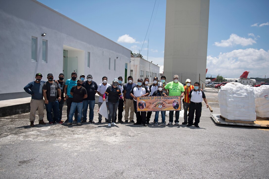 Photos of 22nd Airlift Squadron Airmen loading humanitarian aid at Travis AFB and delivering it to Guatemala.