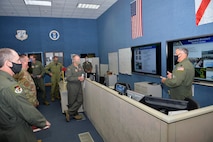 U.S. Air Force Lt. Col. Lewis Hagler, 601st Air Operations Center Air Mobility Division, briefs U.S. Air Force Gen. Mark Kelly, commander of Air Combat Command, on the AOC’s air mobility operations during a visit to Tyndall Air Force Base, Florida, Sept. 29, 2020.