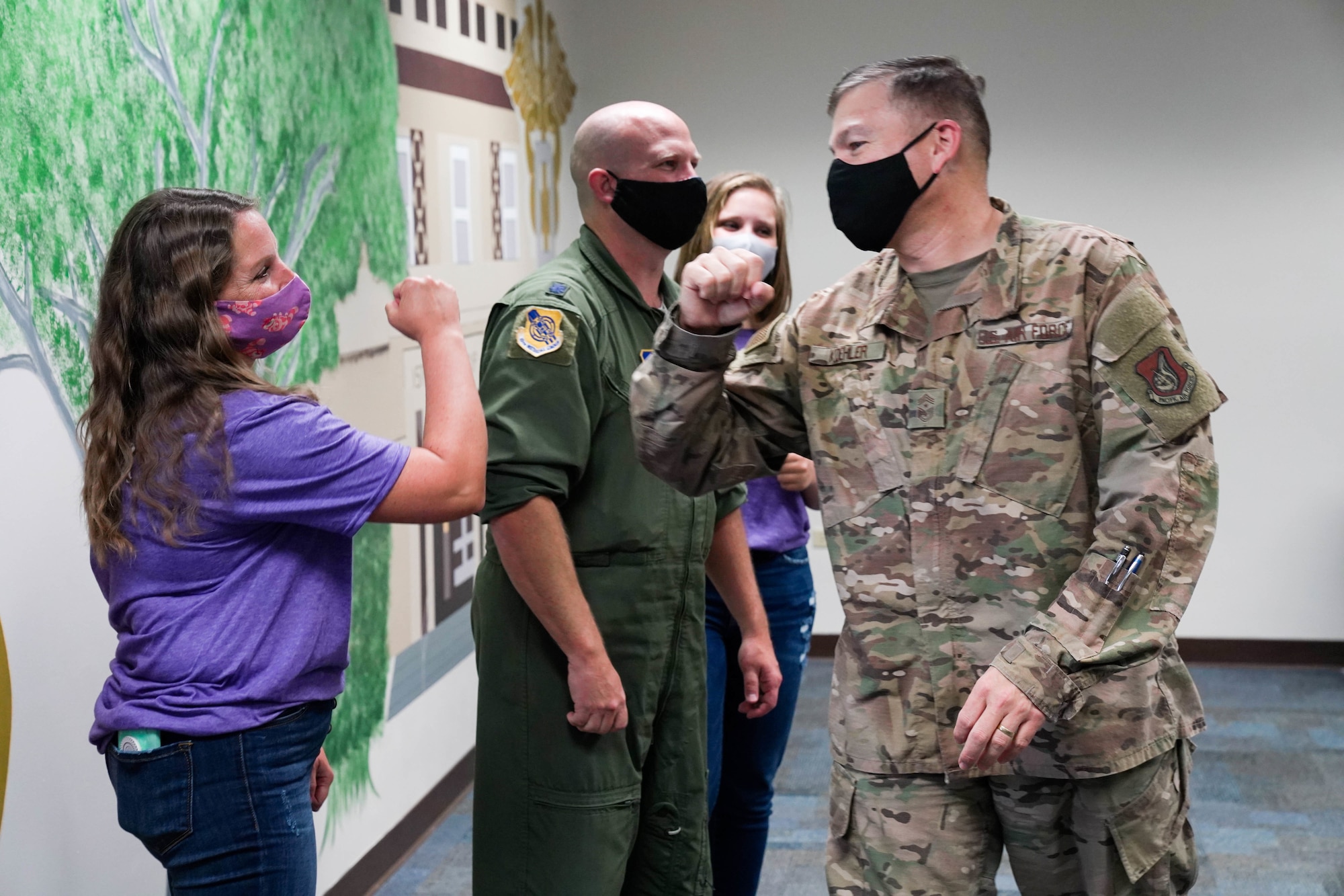 The Hoyt family painted several murals on the walls of the classrooms of the Chief Master Sgt. of the Air Force James C. Binnicker Professional Military Education Center as part of recent renovations at Joint Base Pearl Harbor-Hickam, Hawaii, February 18, 2021. The Hoyts spent a total of 17 days and 625 collective hours to complete five different murals in the PME Center. (U.S. Air Force photo by Airman 1st Class Makensie Cooper)