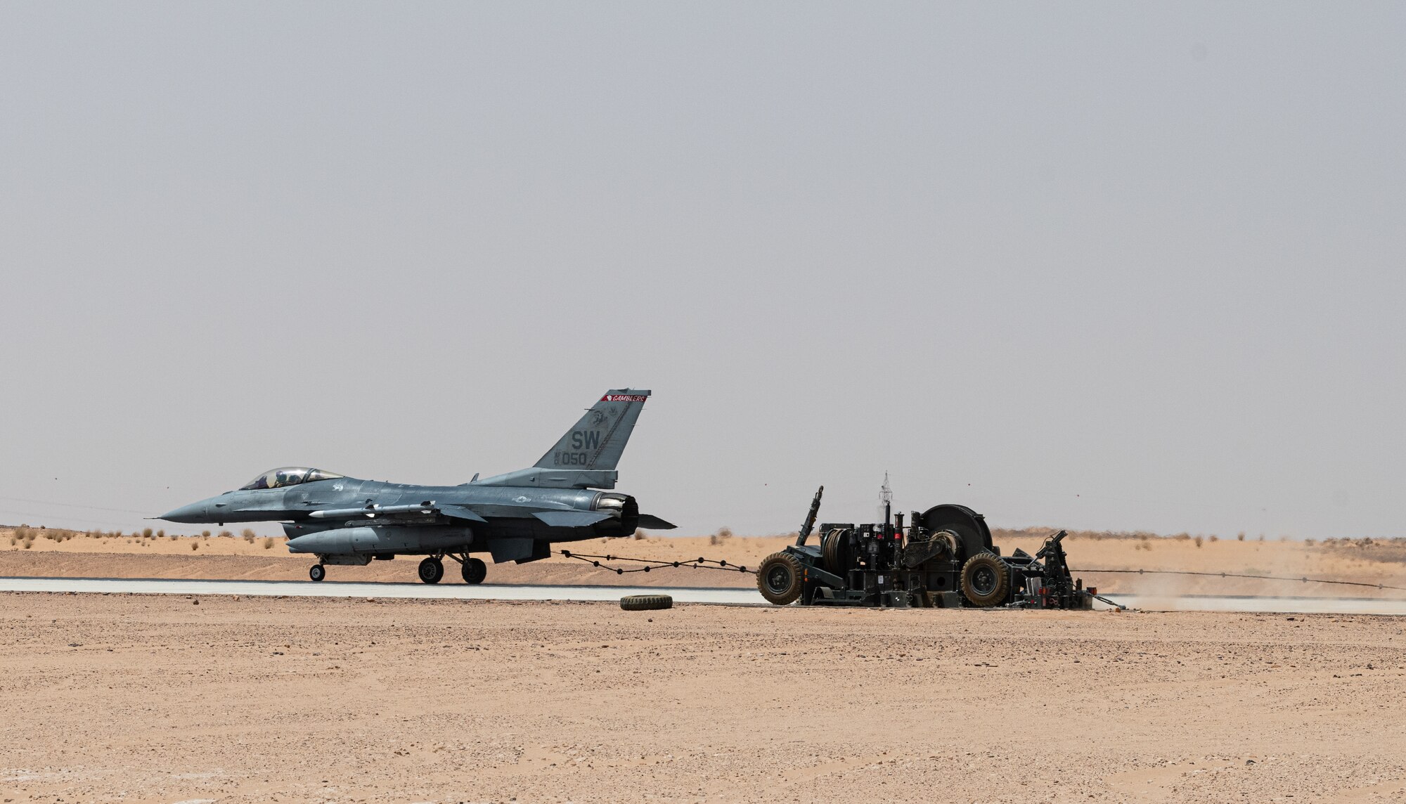 A 77th Expeditionary Fighter Squadron pilot tests an arrest cable March 31, 2021, at Prince Sultan Air Base, Kingdom of Saudi Arabia.