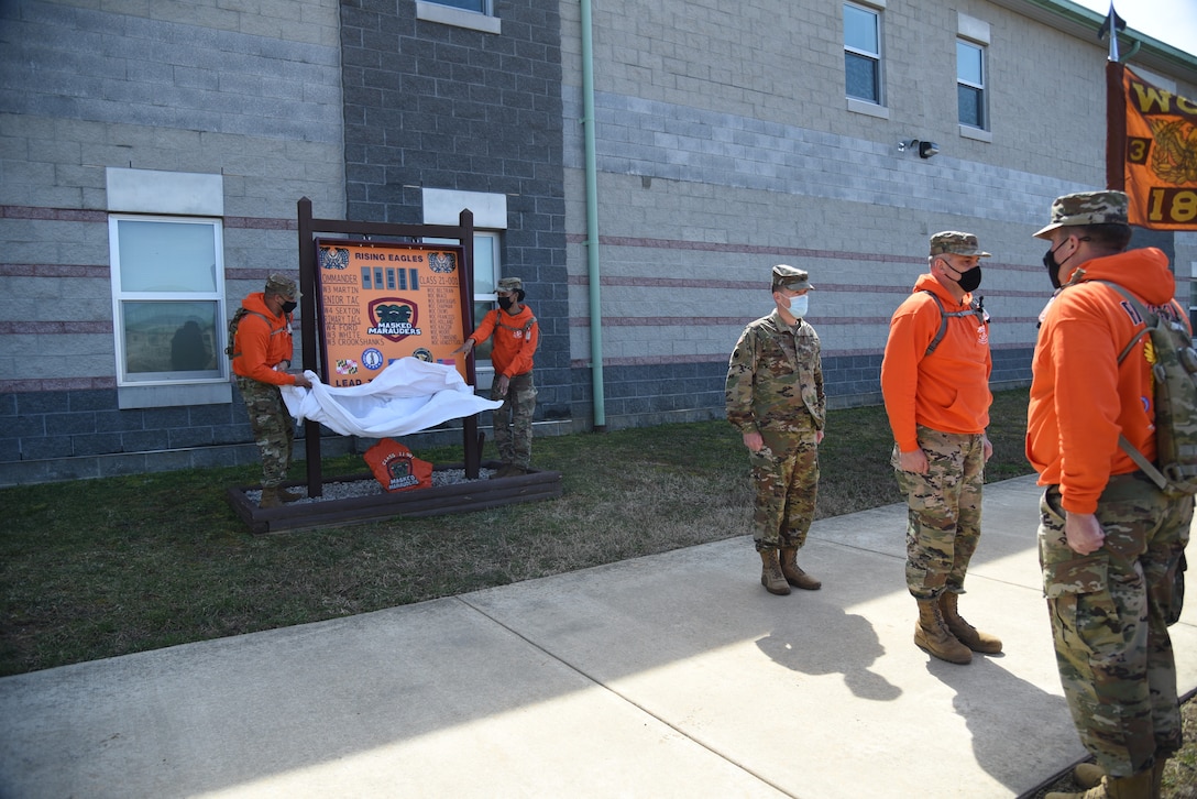 Warrant officer candidates enrolled in the Virginia National Guard’s Warrant Officer Candidate School present their class song and sign to Col. Charles B. Martin, commander of the 183rd Regiment, Regional Training Institute, March 20, 2021, at Fort Pickett, Virginia. The class includes both U.S. National Guard Soldiers from Virginia, Maryland and North Carolina, and U.S. Army Reserve Soldiers. The candidates will head south to Fort McClellan, Alabama, in at the end of April to begin Phase III and the final step toward becoming warrant officers. (U.S. Army National Guard photo by Sgt.1st Class Terra C. Gatti)