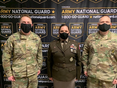 Master Sgt. Jessica Dickenson (center), poses with Maj. Scott Nivens (left), commander of the Virginia National Guard's Recruiting and Retention Battalion, and Sgt. Maj. Stephen Koptchak, the battalion's senior enlisted leader (right), at the Region II Strength Maintenance Advisory Group meeting in Gettysburg, Pennsylvania. Dickenson earned the runner-up spot for top section chief in the region. (Courtesy photo)