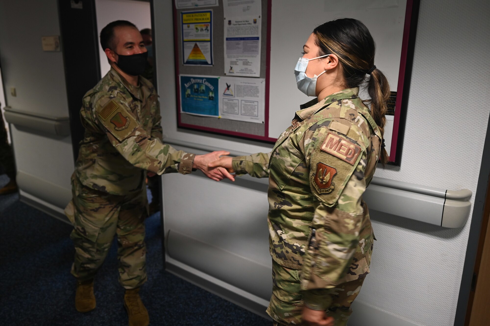 U.S. Air Force Chief Master Sgt. Tommy Childers, 86th Civil Engineer Group superintendent, coins Staff Sgt. Tamara Norwood, 86th Operational Medical Readiness Squadron flight and operation medical technician, during an Airlifter of the Week ceremony