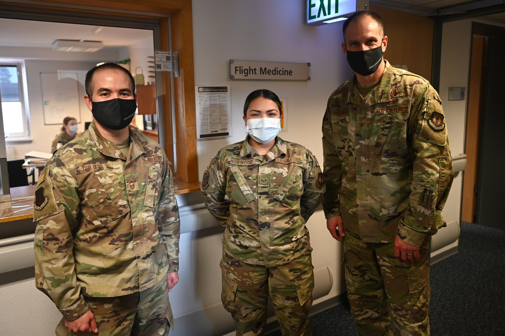 U.S. Air Force Staff Sgt. Tamara Norwood, 86th Operational Medical Readiness Squadron flight and operation medical technician, center, poses for a photo with Chief Master Sgt. Tommy Childers, 86th Civil Engineer Group superintendent, left, and U.S. Air Force Col. Matthew Husemann, 86th Airlift Wing vice commander, during an Airlifter of the Week ceremony
