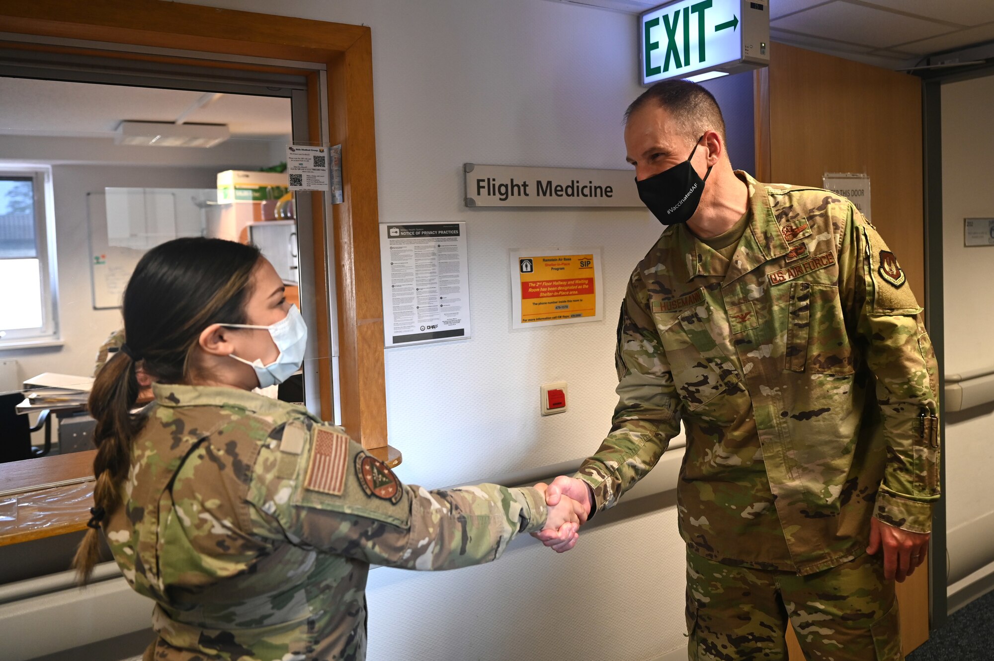 U.S. Air Force Staff Sgt. Tamara Norwood, 86th Operational Medical Readiness Squadron flight and operation medical technician, accepts a coin from U.S. Air Force Col. Matthew Husemann, 86th Airlift Wing vice commander, during an Airlifter of the Week ceremony