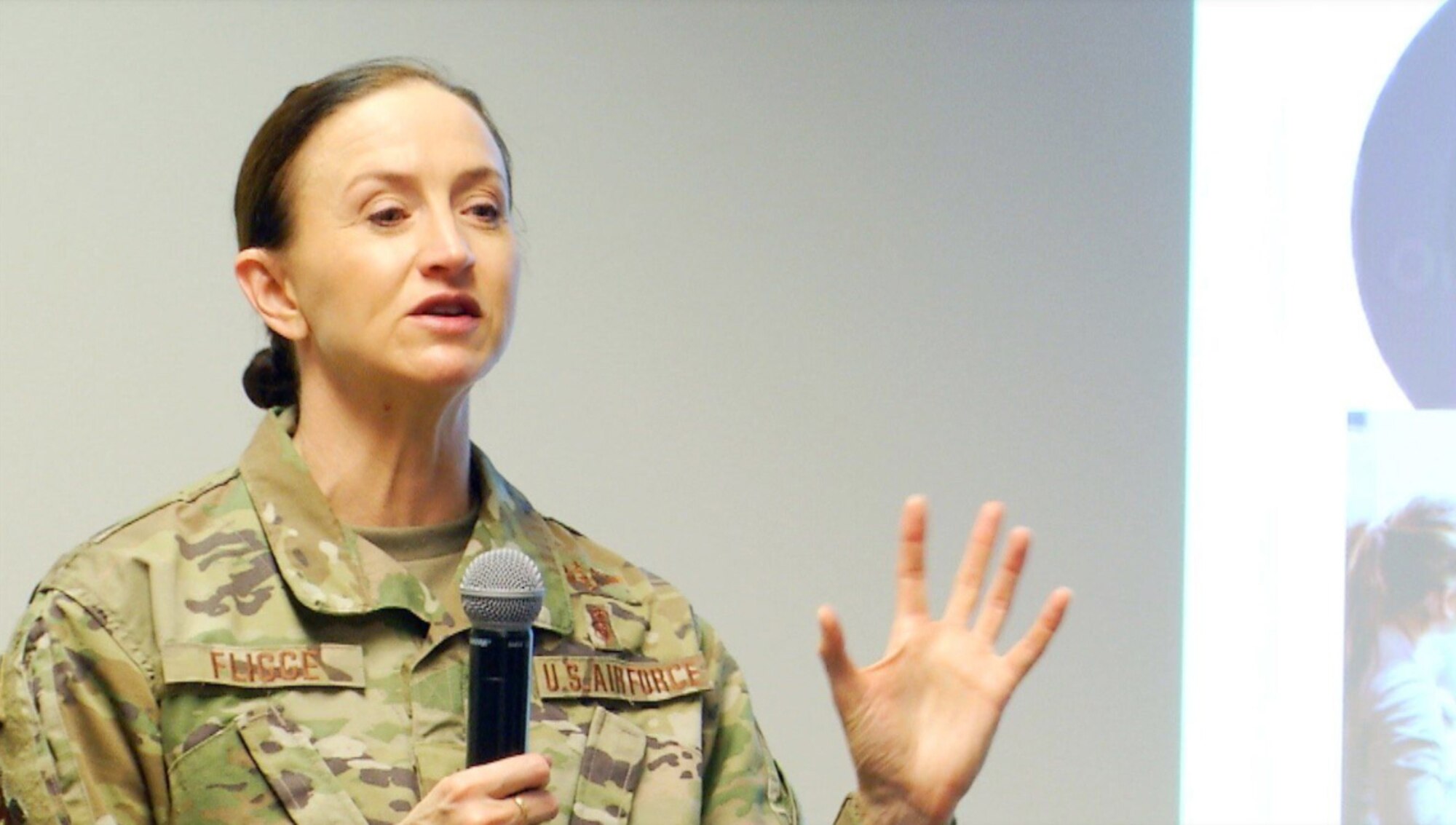 Image of an Airman giving a presentation.