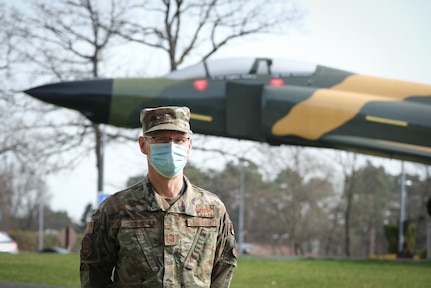 U.S. Air Force Senior Master Sgt. Brad Seymour, technician lead, chief of combat operations for the 603d Air Operations Center, stands for a portrait near a static display F-4 Phantom at Ramstein Air Base, Germany, April 1, 2021. Seymour is a member of the Michigan Air National Guard's 110th Wing, 217th Air Operations Group.