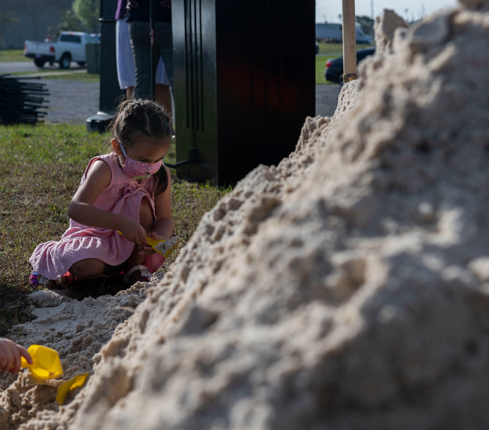A child digs in the sand
