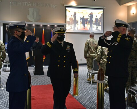 U.S. Navy Lt. Cmdr. John Allen, Navy Center for Information Warfare Training Detachment Goodfellow officer in charge, exchanges salutes with the Sailors during the departure of the official party at the Event Center on Goodfellow Air Force Base, Texas, March 31, 2021. The boatswain’s whistle was used to alert the crew of the departure of the official party. (U.S. Air Force photo by Senior Airman Ashley Thrash)