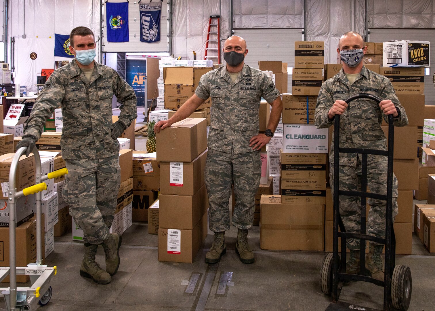 Senior Airman Christopher Parent, Staff Sgt. Dexter Stone and Senior Airman Christopher Albertelli of Task Force Distro, New Hampshire Air National Guard, sport their Airman Battle Uniforms at a PPE warehouse March 31, 2021, in Concord, N.H.