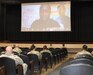 man gives presentation on screen