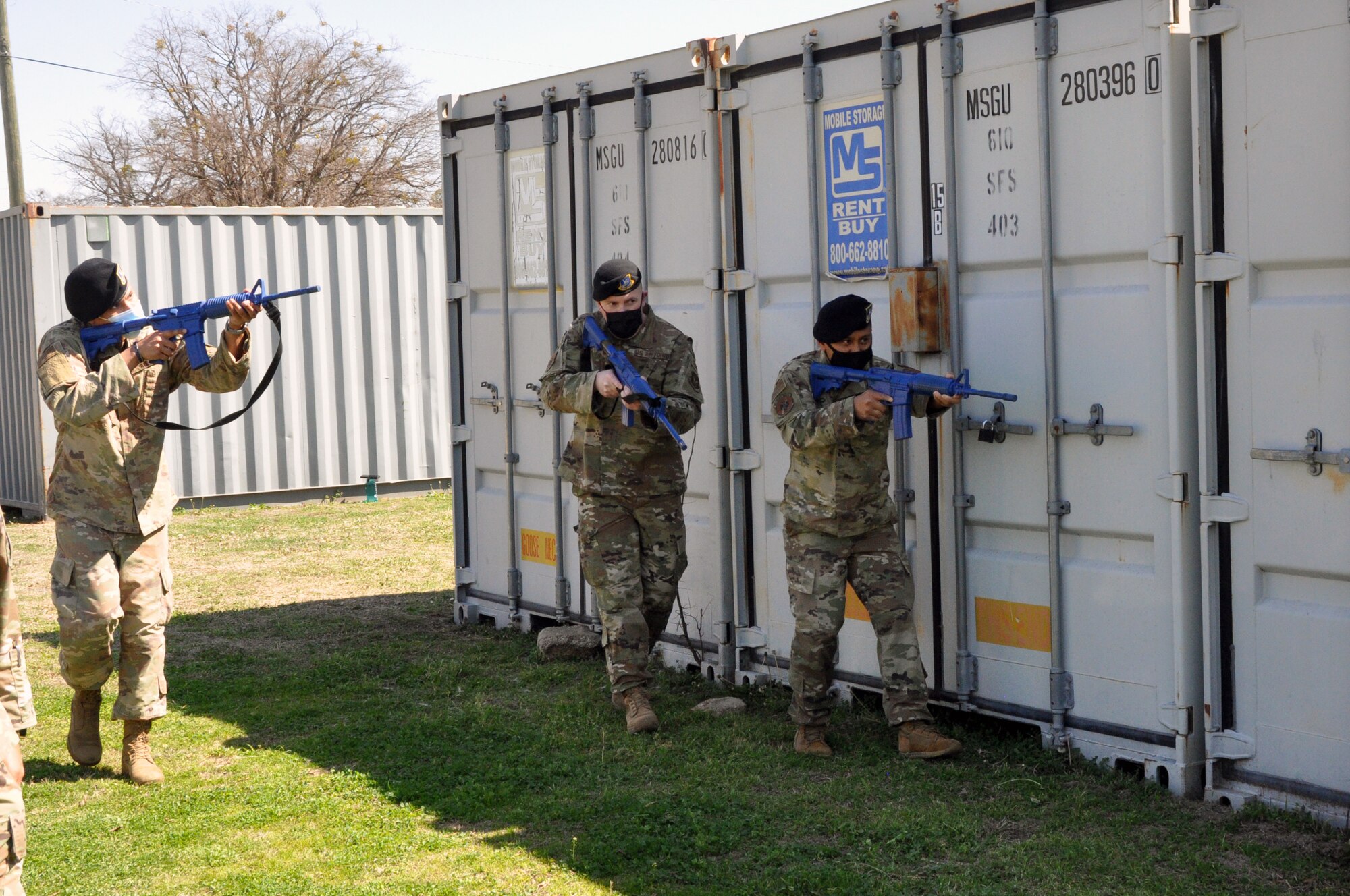 301st Fighter Wing Security Forces Squadron fire team members, (Left) Senior Airman Roy Johnson, (right) Staff Sgt. Kristopher Duque, follow the lead of (center) 301 FW SFS fire team leader, Tech Sgt. Scott Kingston as they perform a walkthrough of shoot, move, communicate during a field training exercise at U.S. Naval Air Station Joint Reserve Base Fort Worth, Texas on March 6, 2021. Field training reinforces security fundamentals so the maneuvers become instinctual, and the Airmen are able to perform under pressure in elevated stress environments. (U.S. Air Force photo by Senior Airman William Downs)