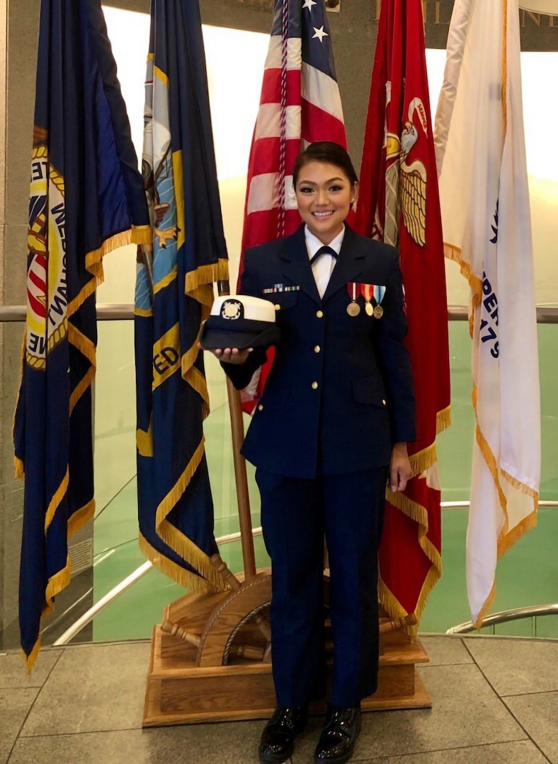 Petty Officer Second Class Julie Nguyen celebrates Rear Adm. Huan Nguyen's promotion ceremony as he becomes the first Vietnamese-American admiral in the U.S. Navy, Oct. 2019 (U.S. Coast Guard Picture).