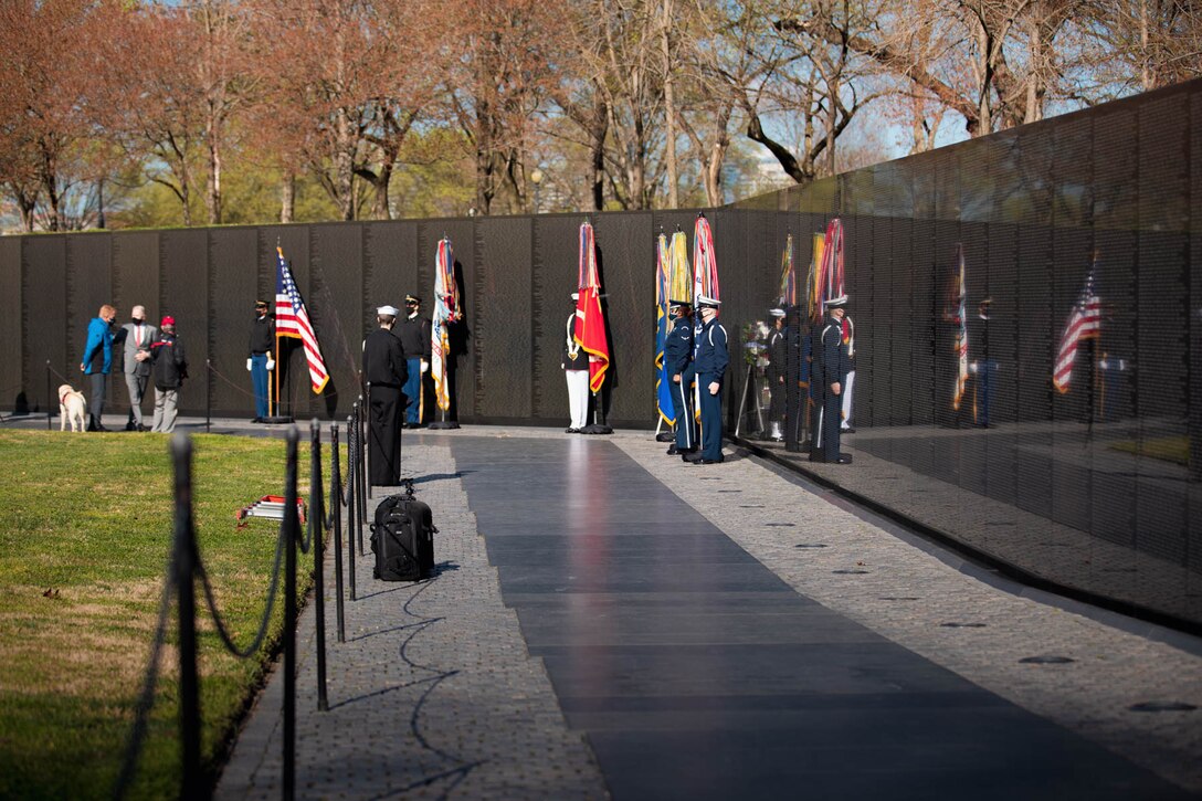 In recognition of National Vietnam War Veterans Day on Monday, March 29, 2021, Trumpet Player Gunnery Sgt. Benjamin Albright sounded "Taps" at the National Vietnam Veterans Memorial Wall in Washington, D.C. During the ceremony, Secretary of Defense Lloyd J. Austin III and Secretary of Veterans Affairs Denis R. McDonough laid a wreath in honor Vietnam War veterans.