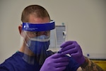 Base Alameda medical clinic personnel draw a dosage of the coronavirus (COVID-19) vaccine from a vial to administer to base medical staff in Alameda, Calif., Dec. 16, 2020. Coast Guard efforts to vaccinate its workforce, in collaboration with DoD, will be complementary to a parallel effort by states, territories, and localities, as vaccine supply allows. U.S. Coast Guard photos by Chief Petty Officer Matt Masaschi.