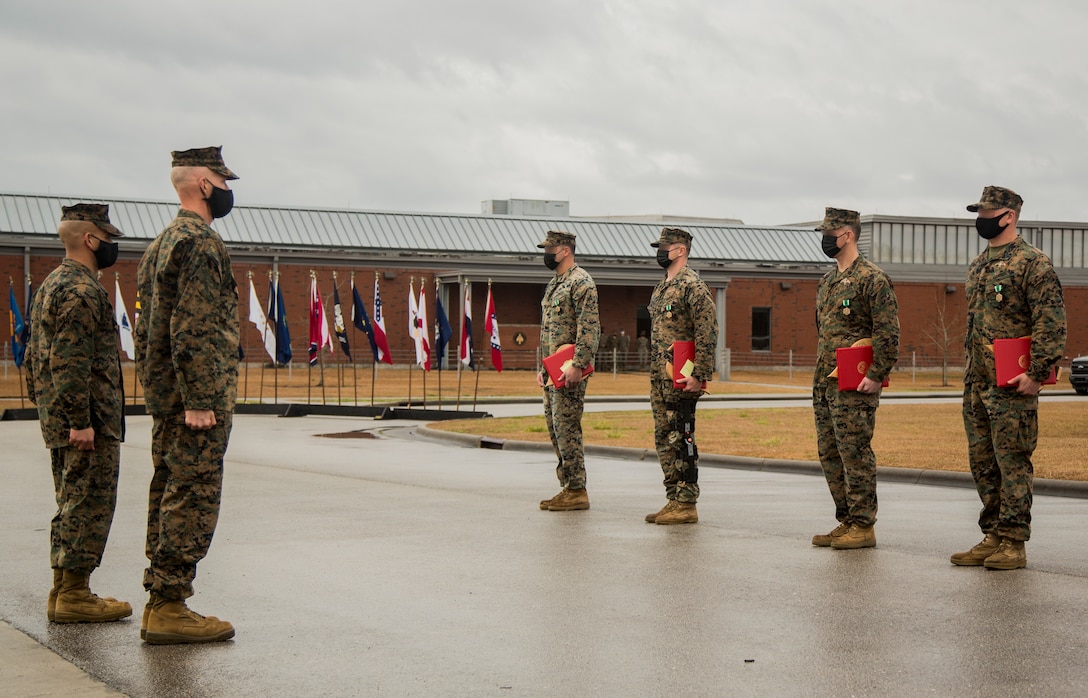 Personnel with Marine Forces Special Operations Command are awarded for their accomplishments during a ceremony at Camp Lejeune, N.C., Feb. 22, 2021. On Feb. 24, 2006, the Marine Corps combined several of its specialized and uniquely trained units, gave them a name and a commander and directed them to become pioneers in a new chapter of Marine Corps history. (U.S. Marine Corps photo by Sgt Jesula Jeanlouis)