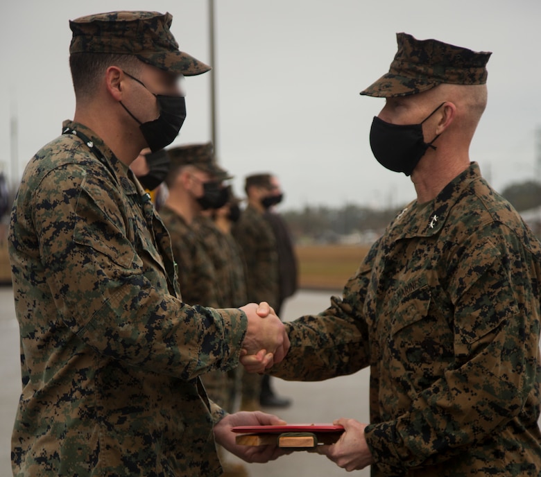 Personnel with Marine Forces Special Operations Command are awarded for their accomplishments during a ceremony at Camp Lejeune, N.C., Feb. 22, 2021. On Feb. 24, 2006, the Marine Corps combined several of its specialized and uniquely trained units, gave them a name and a commander and directed them to become pioneers in a new chapter of Marine Corps history. (U.S. Marine Corps photo by Sgt Jesula Jeanlouis)