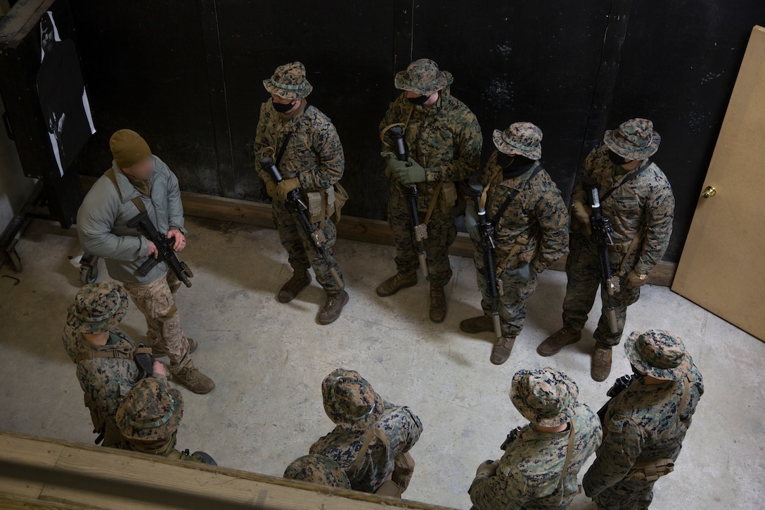 Marine Raiders with 3rd Marine Raider Battalion train Marines with 1st Battalion, 8th Marines on close quarters battles tactics at Camp Lejeune, N.C., Jan. 28, 2021. The training included hallway and stairwell clearing procedures, as well as teaching sensitive site exploitation, which allows for better integration between Special Operations Forces and Fleet Marine Force assets to improve combat readiness for the future operating environment. (U.S. Marine Corps photo by Cpl. Ethan Green)