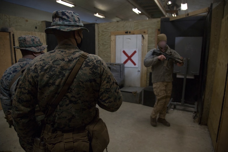 Marine Raiders with 3rd Marine Raider Battalion train Marines with 1st Battalion, 8th Marines on close quarters battles tactics at Camp Lejeune, N.C., Jan. 28, 2021. The training included hallway and stairwell clearing procedures, as well as teaching sensitive site exploitation, which allows for better integration between Special Operations Forces and Fleet Marine Force assets to improve combat readiness for the future operating environment. (U.S. Marine Corps photo by Cpl. Ethan Green)