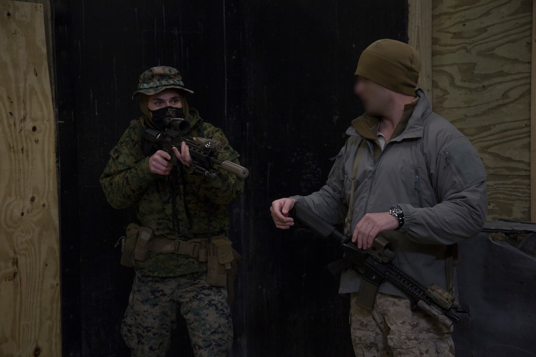 Marine Raiders with 3rd Marine Raider Battalion train Marines with 1st Battalion, 8th Marines on close quarters battles tactics at Camp Lejeune, N.C., Jan. 28, 2021. The training included hallway and stairwell clearing procedures, as well as teaching sensitive site exploitation, which allows for better integration between Special Operations Forces and Fleet Marine Force assets to improve combat readiness for the future operating environment. (U.S. Marine Corps photo by Cpl. Ethan Green)