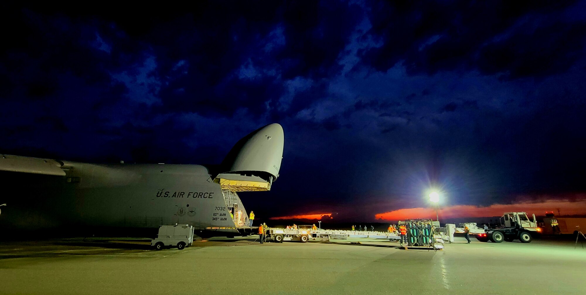 A ground crew unloads the SBIRS GEO-5 from a C-5 Galaxy at Cape Canaveral Air Force Station, Flo., March 18, 2021. The satellite was taken to a processing facility to undergo testing and fueling prior to encapsulation. The satellite is expected to launch in May 2021. (U.S. Air Force photo by Walter Talens)