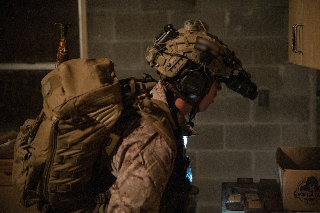Marine Raiders with Golf Company, 2nd Marine Raider Battalion, execute a night raid in support of the Logistics Support Team, Golf Company, 2nd Marine Raider Support Battalion, during Training Exercise II at Marine Corps Base Camp Lejeune, N.C., Dec.11, 2020. This training allows the LST to be evaluated prior to attaching to a Marine Special Operations Company that, in turn, will be capable of supporting full-spectrum special operations. (U.S. Marine Corps photo by Cpl. Brennan Priest)