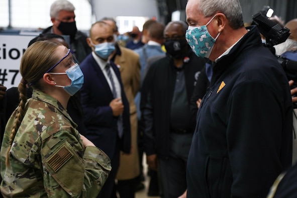 New Jersey governor Phil Murphy converses with U.S. Air Force Airman 1st Class Hannah Zegel, a Millville, New Jersey, native and aerospace medical service specialist assigned to the 59th Medical Operations Squadron.