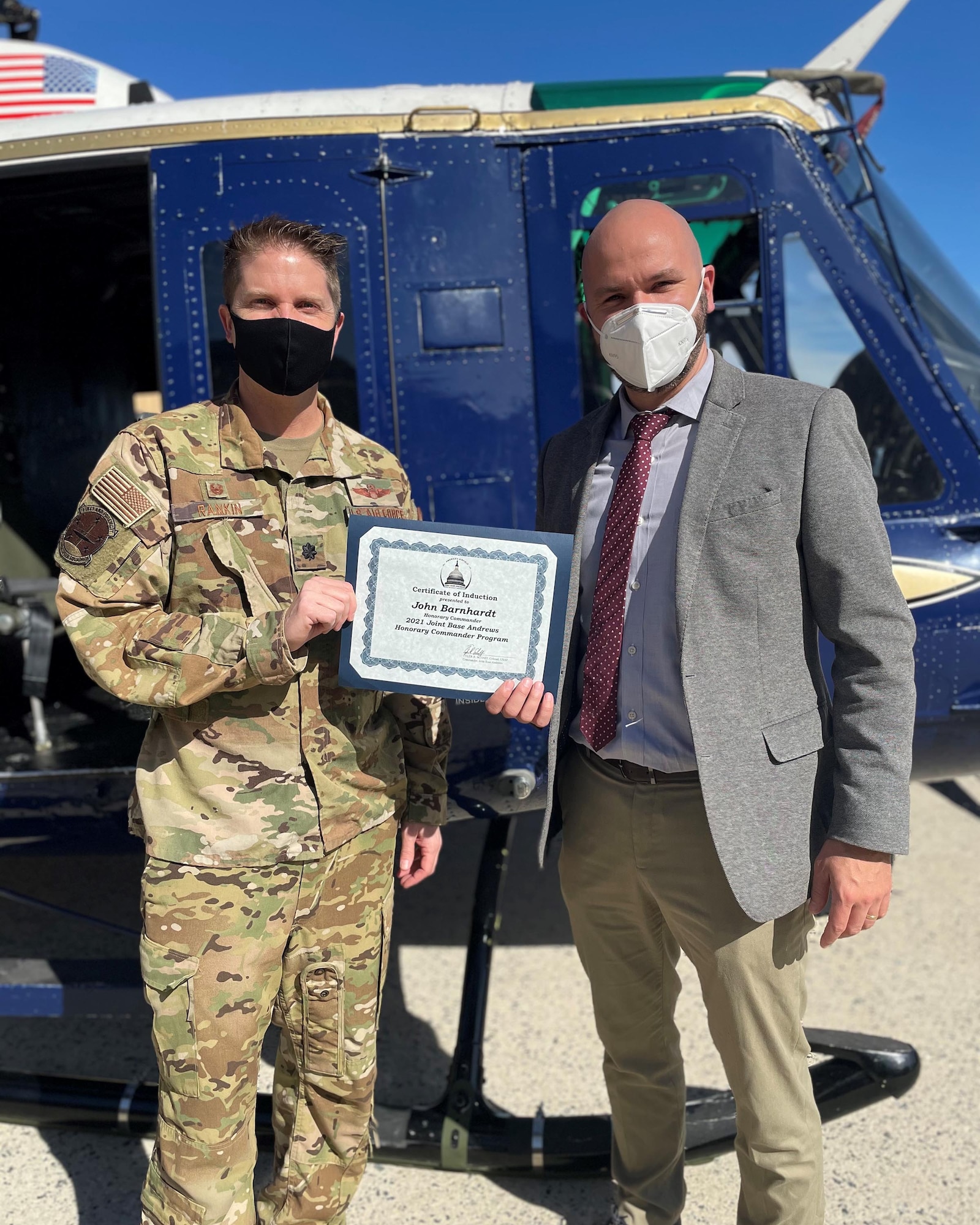 Lt. Col. James Rankin, 1st Helicopter Squadron commander, presents an induction certificate to Dr. John Barnhardt, president and CEO, Bishop McNamara High School, in preparation for the virtual Honorary Commanders Program ceremony on Joint Base Andrews, Md., March 25, 2021. The JBA Honorary Commanders Program gives each inducted local community leader an opportunity to build a relationship with the base and its people. (U.S. Air Force courtesy photo)