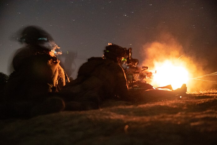 U.S. Marine Corps Lance Cpl. Dylan Pierce, left, a native of Elyria, Ohio, and Pfc. Ricky Nguyen, a native of Nashville, T.N., machine gunners with 2nd Battalion, 8th Marine Regiment, 2nd Marine Division, fire an M240B machine gun during a night live-fire attack on Range G-29, Camp Lejeune, N.C., March 5, 2021. This evolution included platoon level day and night live-fire training to increase proficiencies in dynamic and complex infantry skills. 2nd MARDIV generates lethal forces that are able to support the full spectrum of operations around the world. Small unit leaders are entrusted by their commanders to maintain the highest levels of preparedness for global operations.