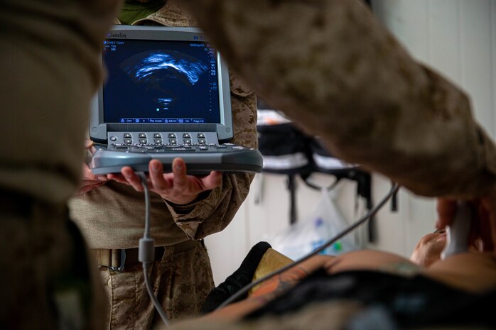 U.S. Navy sailors with Combat Logistics Detachment 31, assigned to the Special Purpose Marine Air - Ground Task Force - Crisis Response - Central Command, treat a simulated casualty during a crisis response exercise in Kuwait, Mar. 8, 2021. The crisis response exercise ensures Marines attached to the SPMAGTF-CR-CC are ready to respond to any crisis in the area of operations.