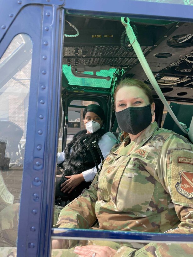 The new 316th Operations Group Honorary Commander, Mrs. Ginger Miller, president and CEO, Women Veterans Interactive, poses with Col. Anne-Marie Contreras, 316th Operations Group commander, in preparation for the virtual Honorary Commanders Program ceremony on Joint Base Andrews, Md., March 25, 2021. The JBA Honorary Commander Program, matches a civic leader with a military leader to provide commanders a means to educate participants about the armed forces and their various missions. (U.S. Air Force courtesy photo)