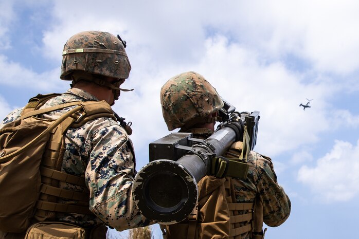 U.S. Marine Corps Cpl. Joshua English (left), and Lance Cpl. Griffin Rose, both low altitude air defense gunners with 3rd Low Altitude Air Defense Battalion, 1st Marine Aircraft Wing, provide surface-to-air defense using the FIM-92 Stinger during Castaway 21.1 on Ie Shima, Okinawa, Japan, March 16, 2021. The exercise demonstrated the Marine Corps’ ability to integrate with the joint force to seize and defend key maritime terrain, provide low-signature sustainment, and execute long-range precision fires in support of naval operations from an expeditionary advanced base. English is native of Vista, California, and Rose is a native of Chicago, Illinois.