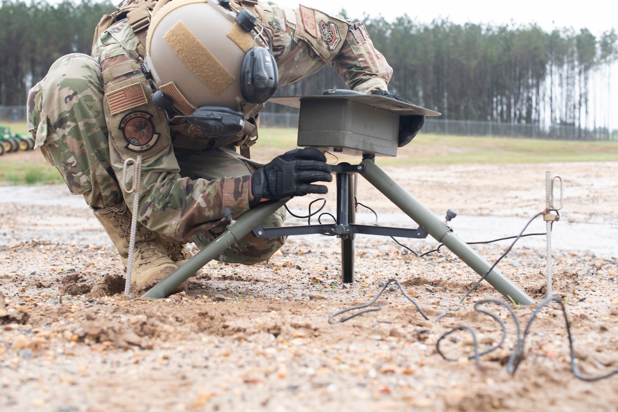 U.S Air Force Master Sgt. James Gragg, 321st Contingency Response Squadron noncommissioned officer in charge of weather, sets up weather observation equipment March 25, 2021, during Exercise Turbo Distribution 21-2 at Camp Shelby, Mississippi. Turbo Distribution is a joint task force port opening aerial port of debarkation field training exercise that was held March 24-31. Participating units included the 621st Contingency Response Group stationed at Joint Base McGuire-Dix-Lakehurst, New Jersey, and the U.S. Army 688th Rapid Port Opening Element stationed at Joint Base Langley-Eustis, Virginia. (U.S. Air Force photo by Tech. Sgt. Luther Mitchell)
