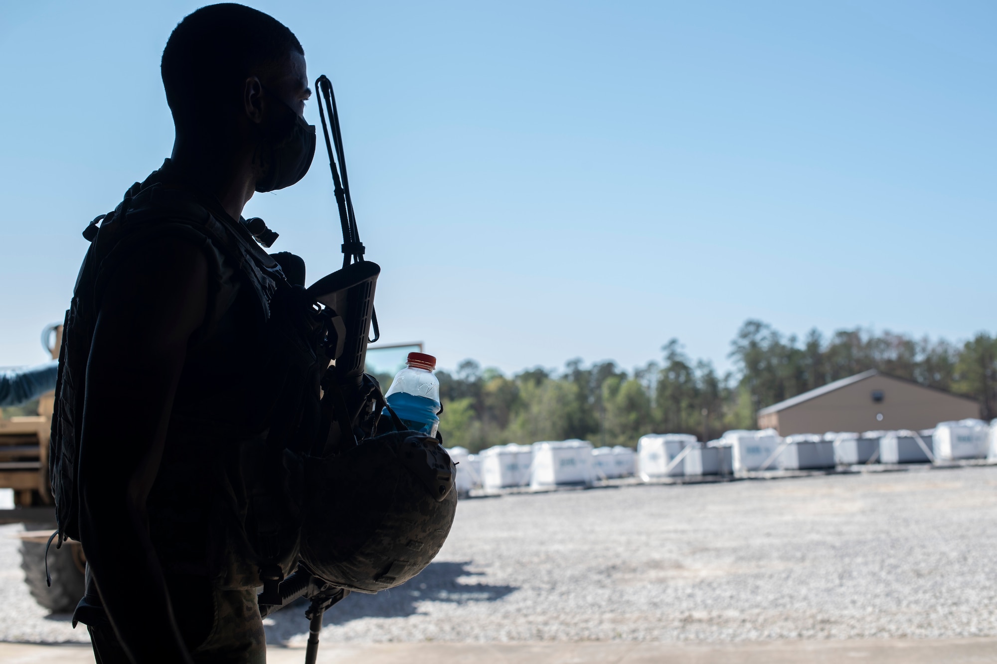 U.S. Army Spc. Xavier McCain, 688th Rapid Port Opening Element transportation management coordinator, overlooks simulated relief supplies March 29, 2021, at the forward operating node during Exercise Turbo Distribution 21-2 at Camp Shelby, Mississippi. Turbo Distribution is a joint task force port opening aerial port of debarkation field training exercise that was held March 24-31. Participating units included the 621st Contingency Response Group stationed at Joint Base McGuire-Dix-Lakehurst, New Jersey, and the U.S. Army 688th Rapid Port Opening Element stationed at Joint Base Langley-Eustis, Virginia. (U.S. Air Force photo by Tech. Sgt. Luther Mitchell)