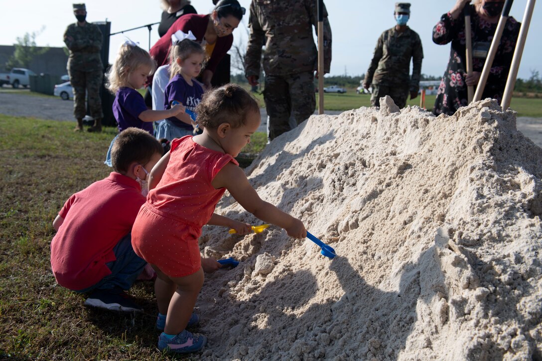Children dig in the sand