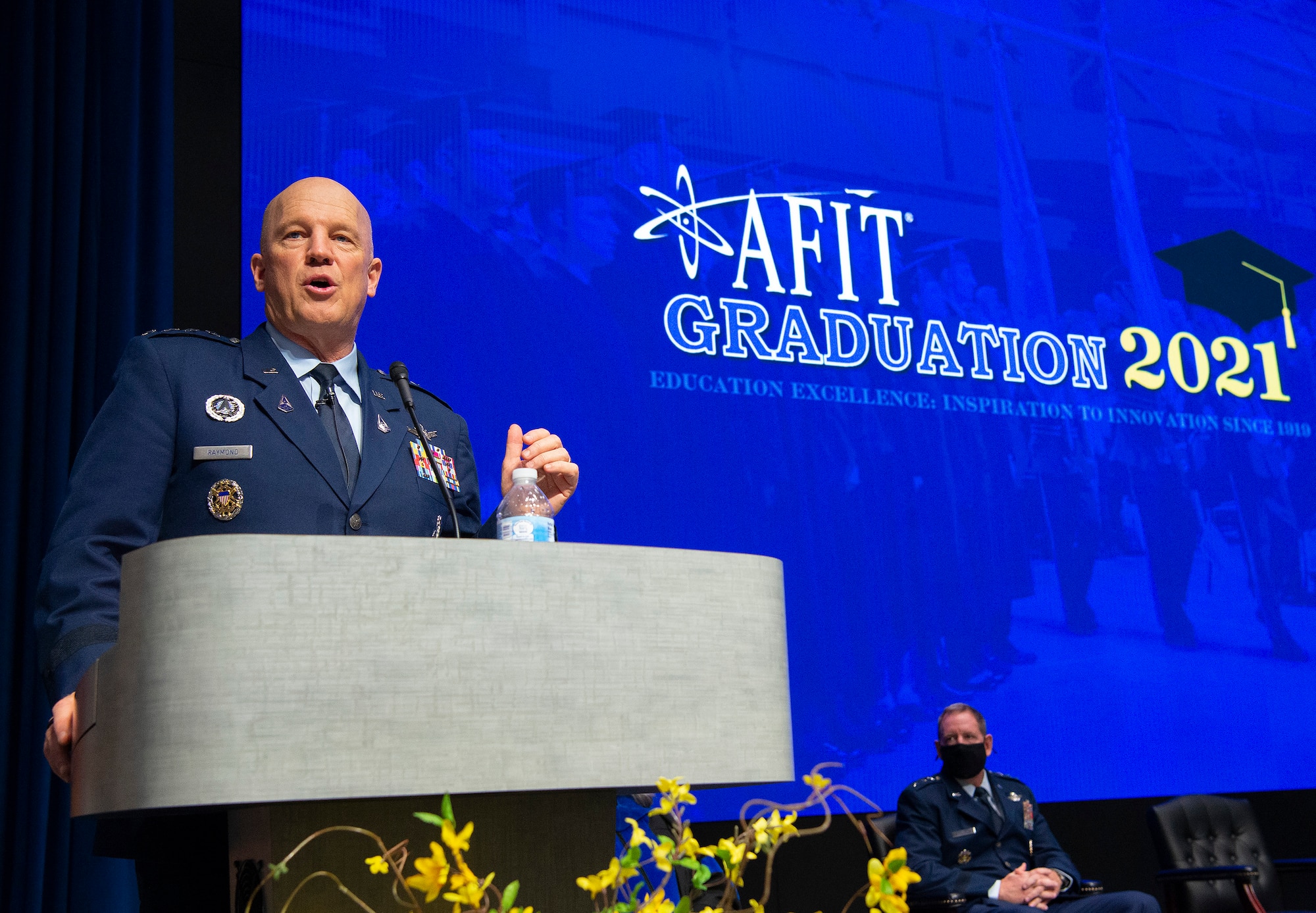 United States Space Force Gen. John W. Raymond, Chief of Space Operations, gives the graduation address at the Air Force Institute of Technology graduation ceremony on Wright-Patterson Air Force Base, Ohio. March 25, 2021. The graduating class of more than 200 students included 33 Guardians earning their advanced degrees. (U.S. Air Force photo by R.J. Oriez)
