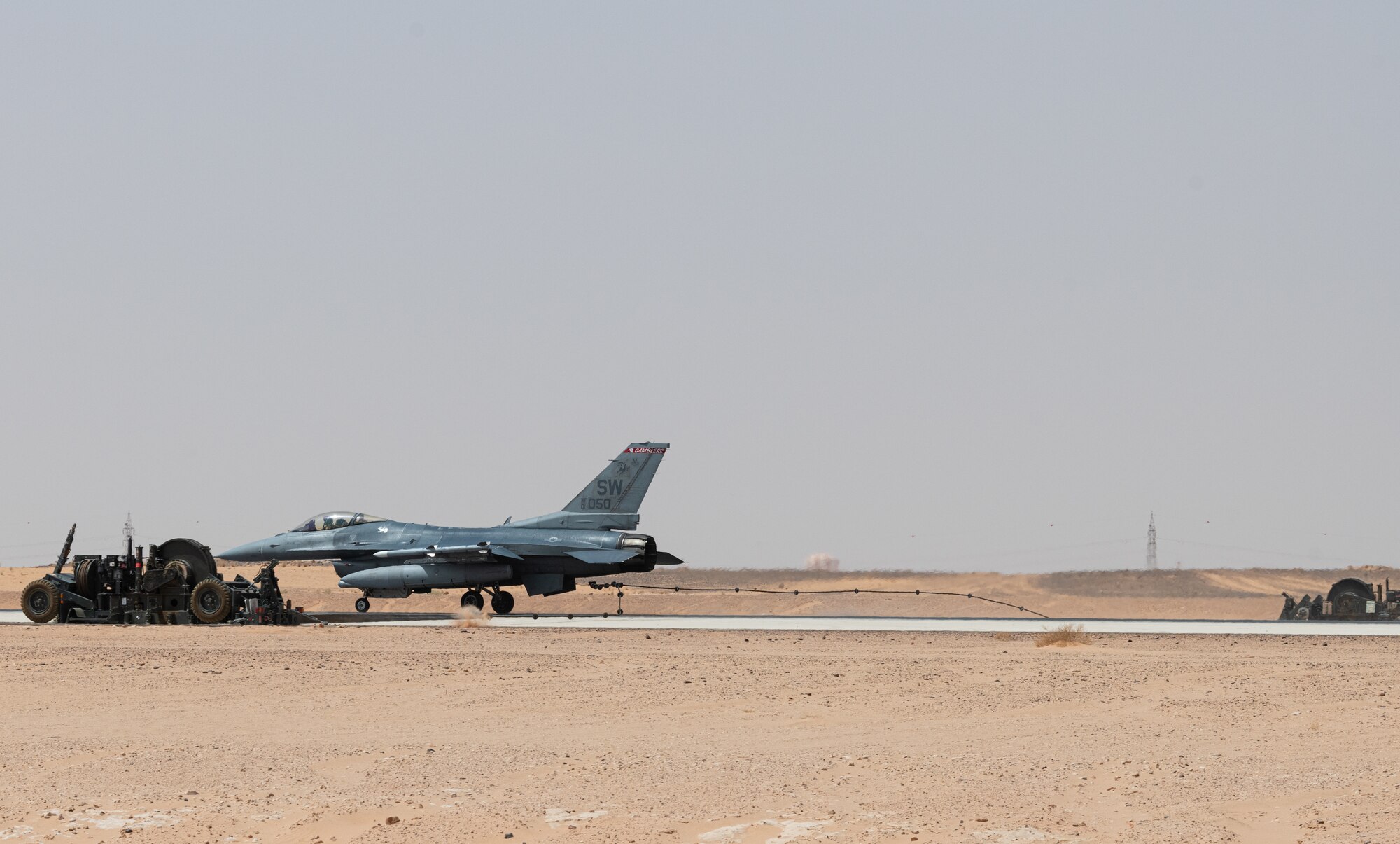 A 77th Expeditionary Fighter Squadron pilot tests an arrest cable March 31, 2021, at Prince Sultan Air Base, Kingdom of Saudi Arabia.