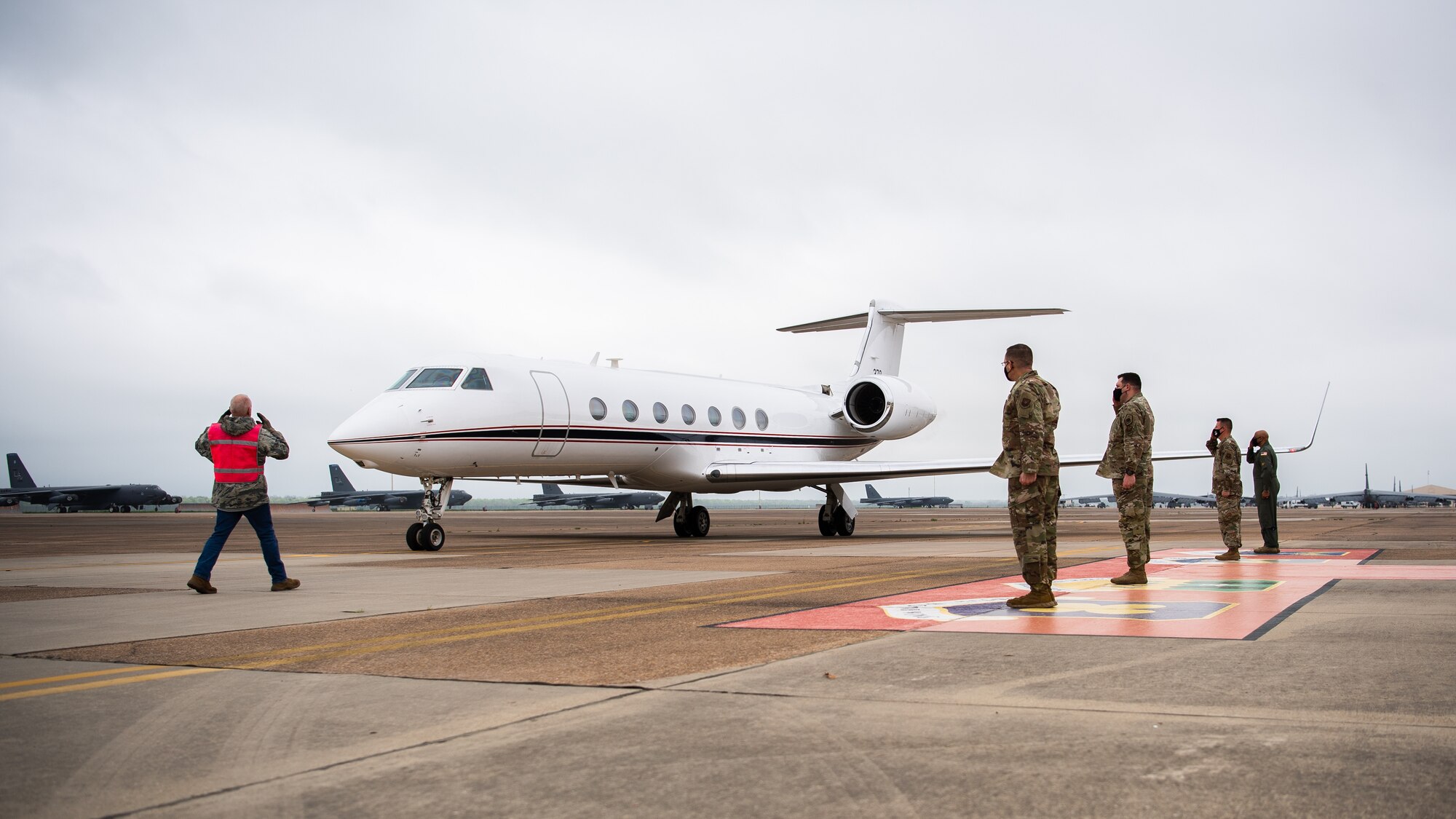 Leaders from the 2nd Bomb Wing and Air Force Global Strike Command salute during the arrival of Adm. Charles Richard, U.S. Strategic Command commander, at Barksdale Air Force Base, Louisiana, March 30, 2021. Richard visited Barksdale to present the 96th Bomb Squadron with the 2020 Omaha Trophy, a prestigious award given to premier units of USSTRATCOM. (U.S. Air Force photo by Airman 1st Class Jacob B. Wrightsman)