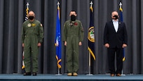 (Left to right) Adm. Charles Richard, U.S. Strategic Command commander, Lt. Col. Christopher Duff, 96th Bomb Squadron commander, and Mr. Tim Burke, Strategic Command Consultation Committee chairman, stand at the position of attention during the presentation of the Omaha Trophy to the 96th BS at Barksdale Air Force Base, Louisiana, March 30, 2021.The Omaha Trophy is awarded each year to various units in recognition of outstanding support to USSTRATCOM's strategic deterrence mission (U.S. Air Force photo by Airman 1st Class Jacob B. Wrightsman)