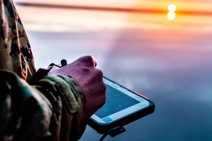 U.S. Marine Corps Sgt. Jeramiah Meade, a section chief with 2nd Radio Battalion, 2nd Marine Division, uses a electronic warfare system during a joint-service training exercise on Marine Corps Air Station Cherry Point, N.C., March 26, 2021. The purpose of the week-long training was to increase interoperability with the U.S. Coast Guard and provide 2nd Marine Division reconnaissance battalions with the opportunity to become familiarized with quick reaction and counter electronic warfare concepts.