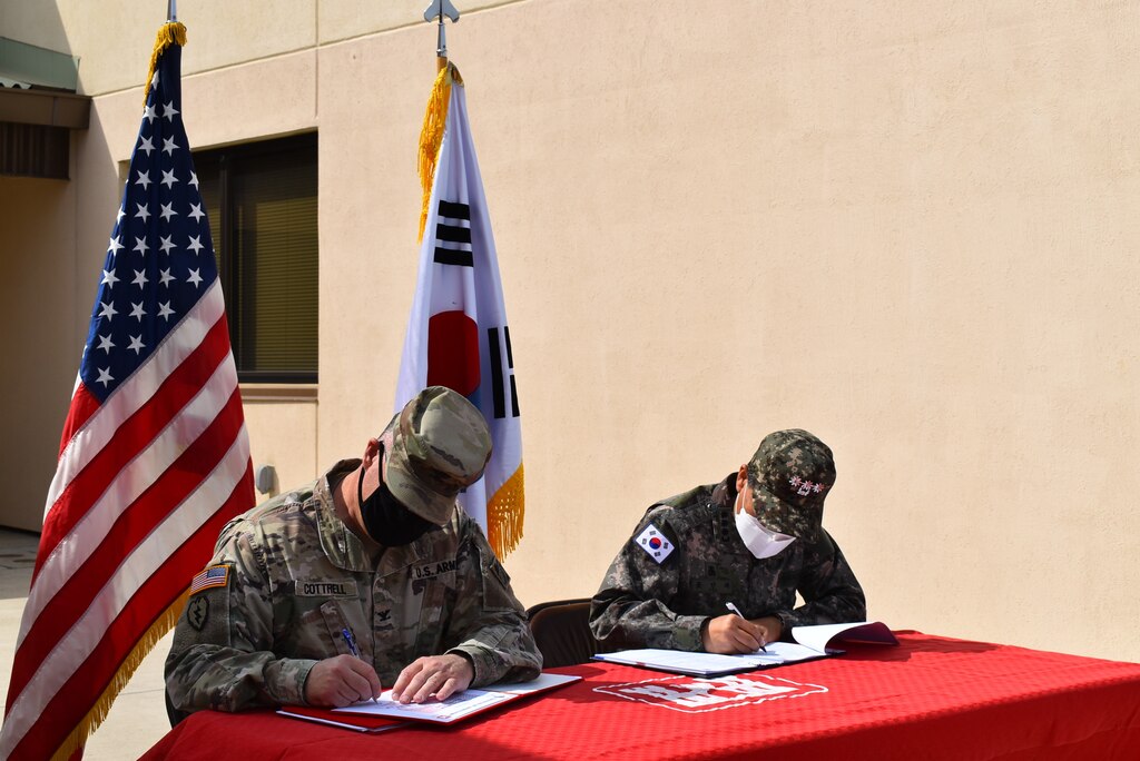 Captured is the new Army storage warehouse staging and loading docks, which was turned over to Col. Garrett Cottrell, Deputy Commanding Officer - Transformation, U.S. Army Corps of Engineers Far East District, on behalf of the U.S. government by Col. Pyo In Tae, ROK Design and Construction Agent, on behalf of the ROK government during the Acceptance Release Letter signing at USAG Humphreys, Republic of Korea, Apr. 2, 2021.