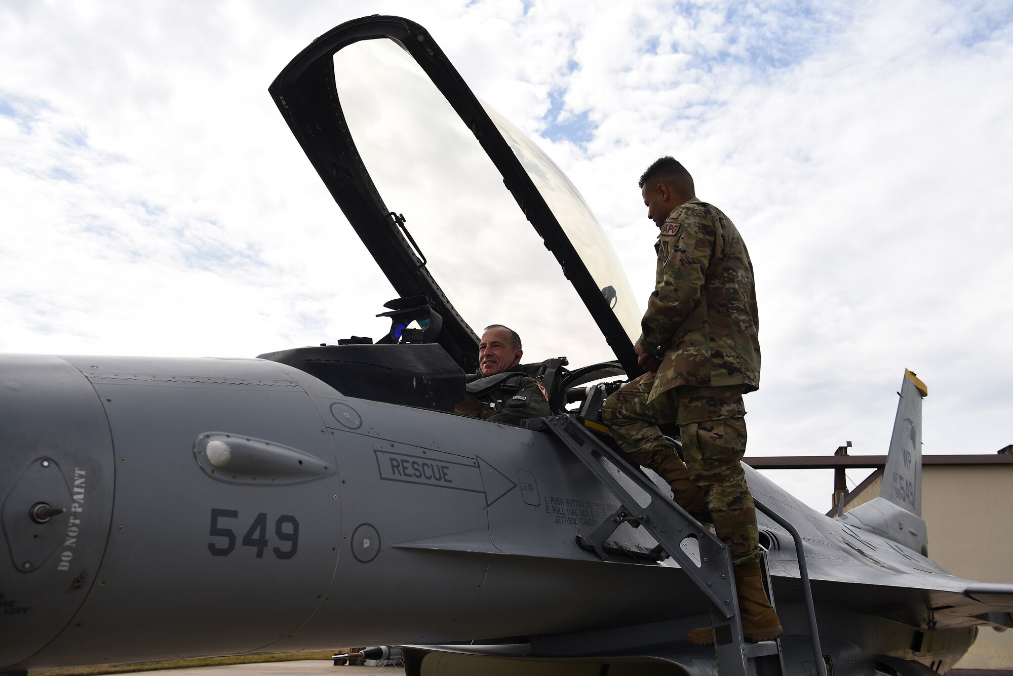 Senior Airman Mequail Fridge, 8th Aircraft Maintenance Squadron crew chief, prepares Lt. Gen. Scott Pleus, 7th Air Force commander, for flight at Kunsan Air Base, Republic of Korea, April 1, 2021. During his visit, Pleus held a mentorship session with Kunsan’s company grade officers, toured the O’Malley Dining Facility, visited the fighter squadrons and more. (U.S. Air Force photo by Senior Airman Suzie Plotnikov)